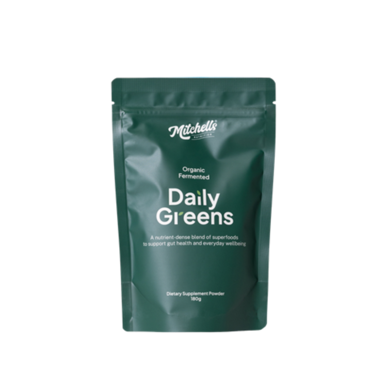 A Supplement container with the name Daily Greens by Mitchell's Nutrition.