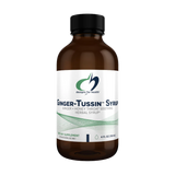 Image of a supplement bottle that says desgins for health ginger- tussin syrup ginger+honey throat soothing herbal syrup dietary supplement