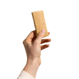 A hand holding a Strawberry Shortcake  Bar by Good Betty. 